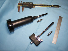 Load image into Gallery viewer, These little guys will adapt Torque Wrenches, used by Banjo Players and Drummers, to a standard 1/4" drive sockets.  Buy a nice deepwell socket in the correct size for your banjo, and it is fastened securely to your wrench with o-rings.  Made of stainless steel.  They come with spare o-rings.  Make it easy on yourself!  (Note: The center "body" shape of the adapter may be different than shown.)